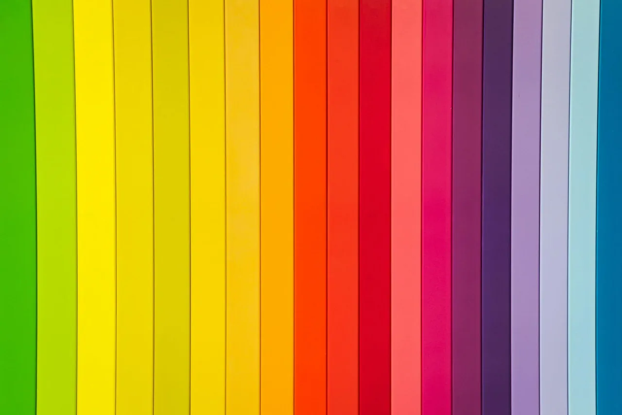 Wall panels arranged in a rainbow of colours.
