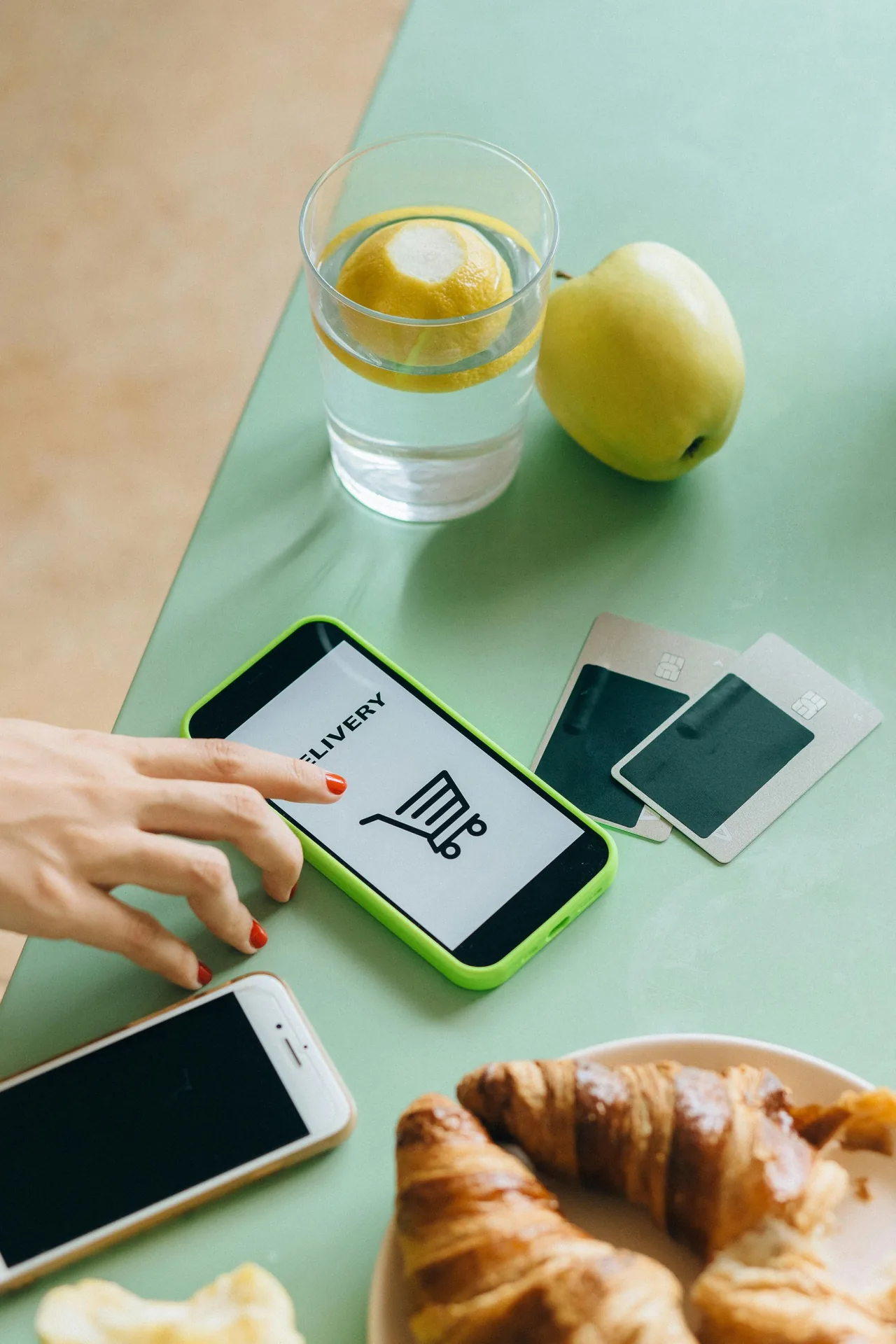QR code displayed on a mobile device beside other devices on a table.